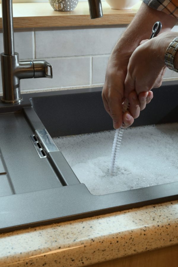 Overflowing kitchen sink, clogged drain. Overflowing kitchen sink, clogged drain, plumbing problems, trying to unclog